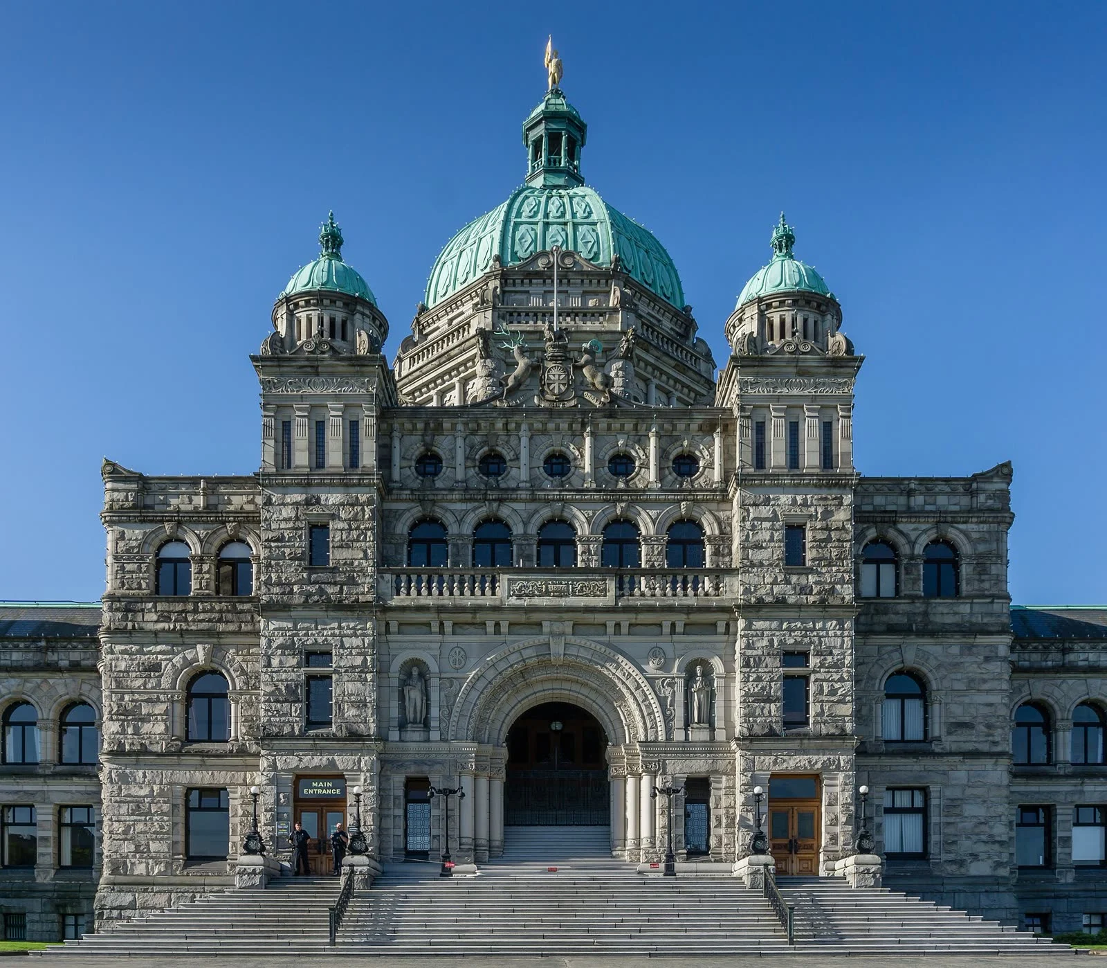 B.c. Snap Election 2026 — Eby Calls Oct. 24 Vote Over Trump'S Trade War 2 B.C. Snap Election 2026: Front entrance of the British Columbia Parliament Buildings in Victoria, B.C., with its copper dome under a clear blue sky
