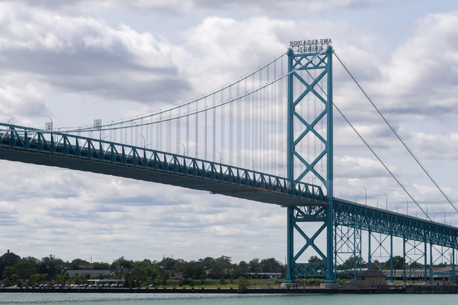 Cbsa Essex County Firearms Bust 2026 — 53 Guns Seized, Man Charged In Cross-Border Smuggling Ring The Ambassador Bridge between Windsor and Detroit amid the Essex County Firearms Bust crackdown at the border.