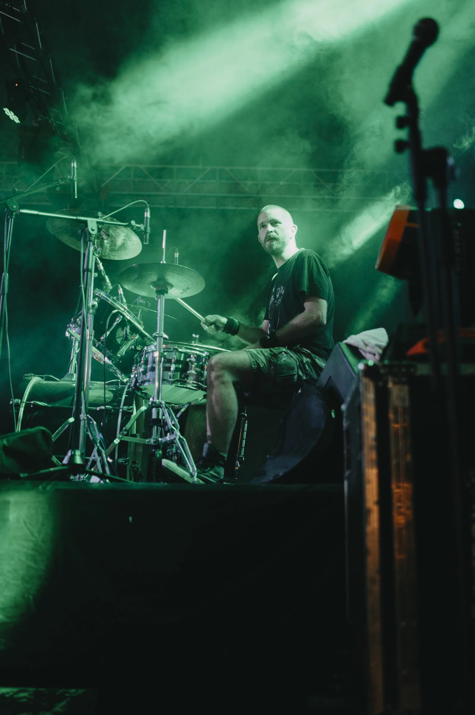 Winnipeg Concerts Fall 2026 — Arena Rock, The Burton Cummings Theatre'S Packed Autumn And A Sold-Out Symphony Night 3 Drummer performing under green stage lights in front of an enthusiastic concert crowd