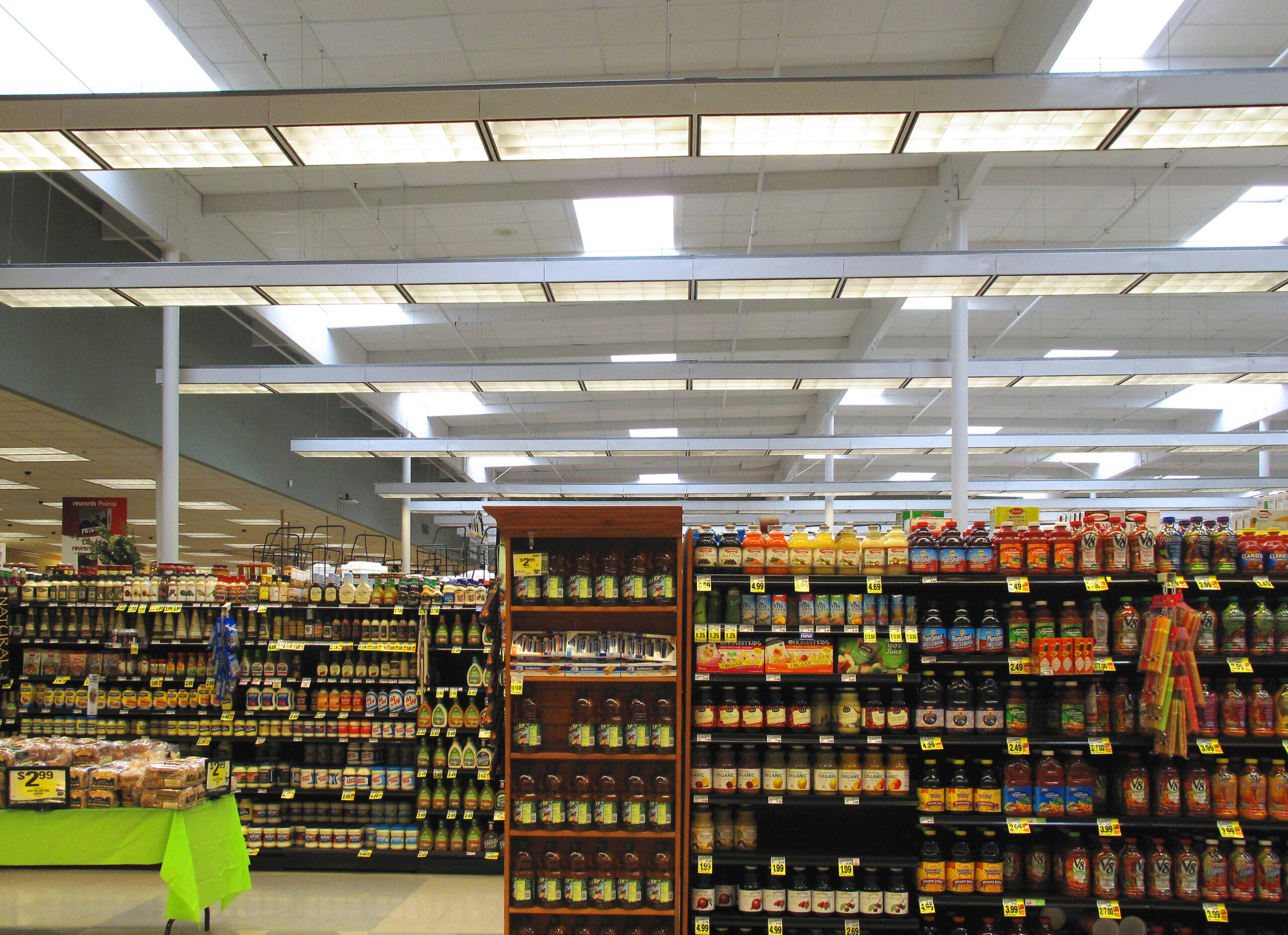 Canada Grocery Prices 2026 — What'S Getting Cheaper, What'S Still Hurting, And Why Your Bill Isn'T Falling 3 Packaged food shelves inside a grocery store