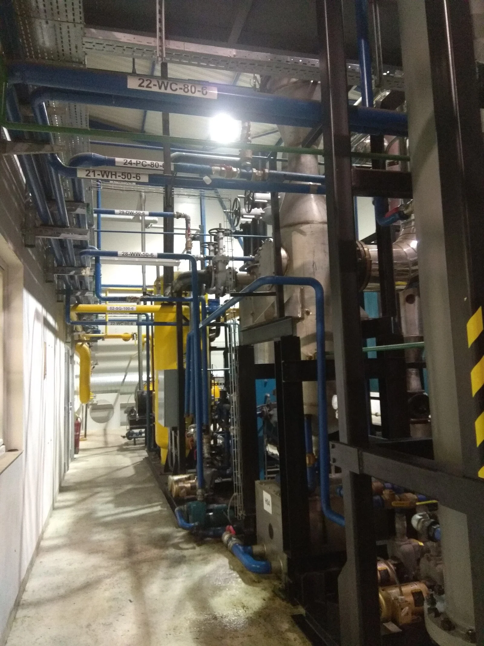 Haffner Energy Bécancour Multi-Energy Hub 2026 — €3.2M Order Fires Up Quebec'S First Green Fuel Hub 1 Gasification plant piping at a biomass facility, illustrating the Haffner Energy Bécancour Multi-Energy Hub technology