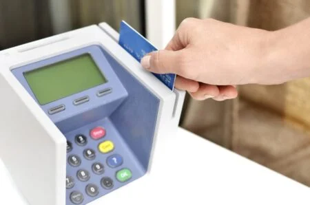 Hands paying with a credit card