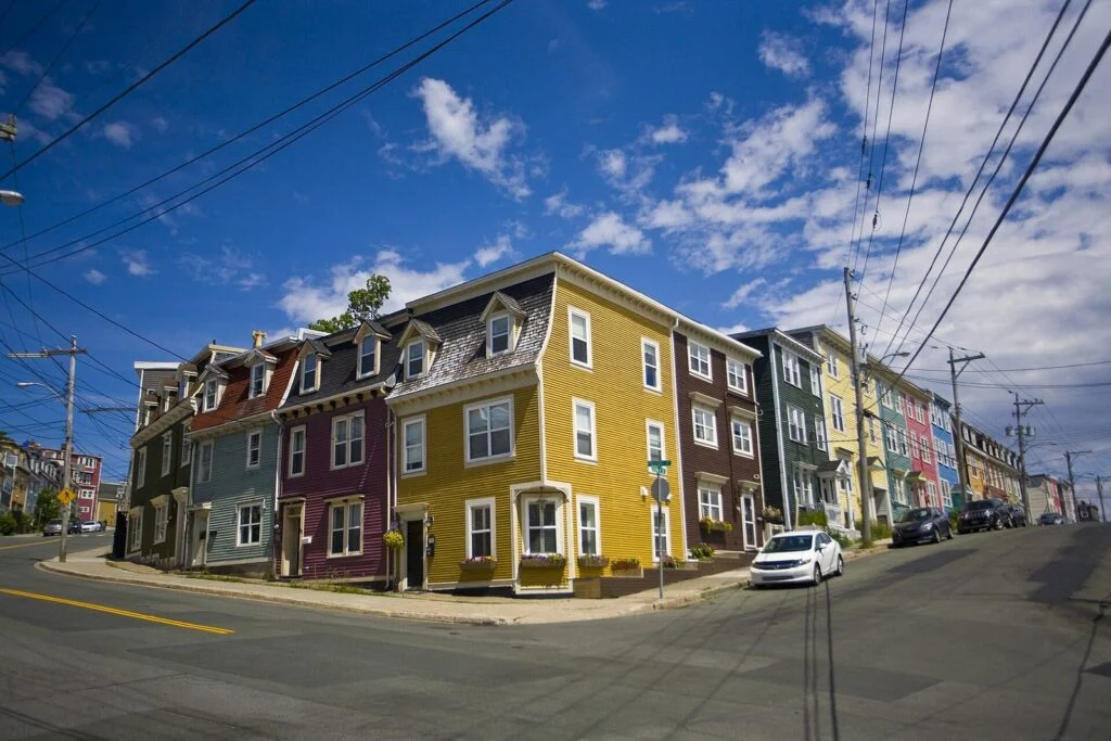 Newfoundland And Labrador Home Repair Program 2026 — Doubled Forgivable Loans Open October 1 Newfoundland and Labrador Home Repair Program: colourful row houses (Jellybean Row) on a street corner in St. John's, Newfoundland