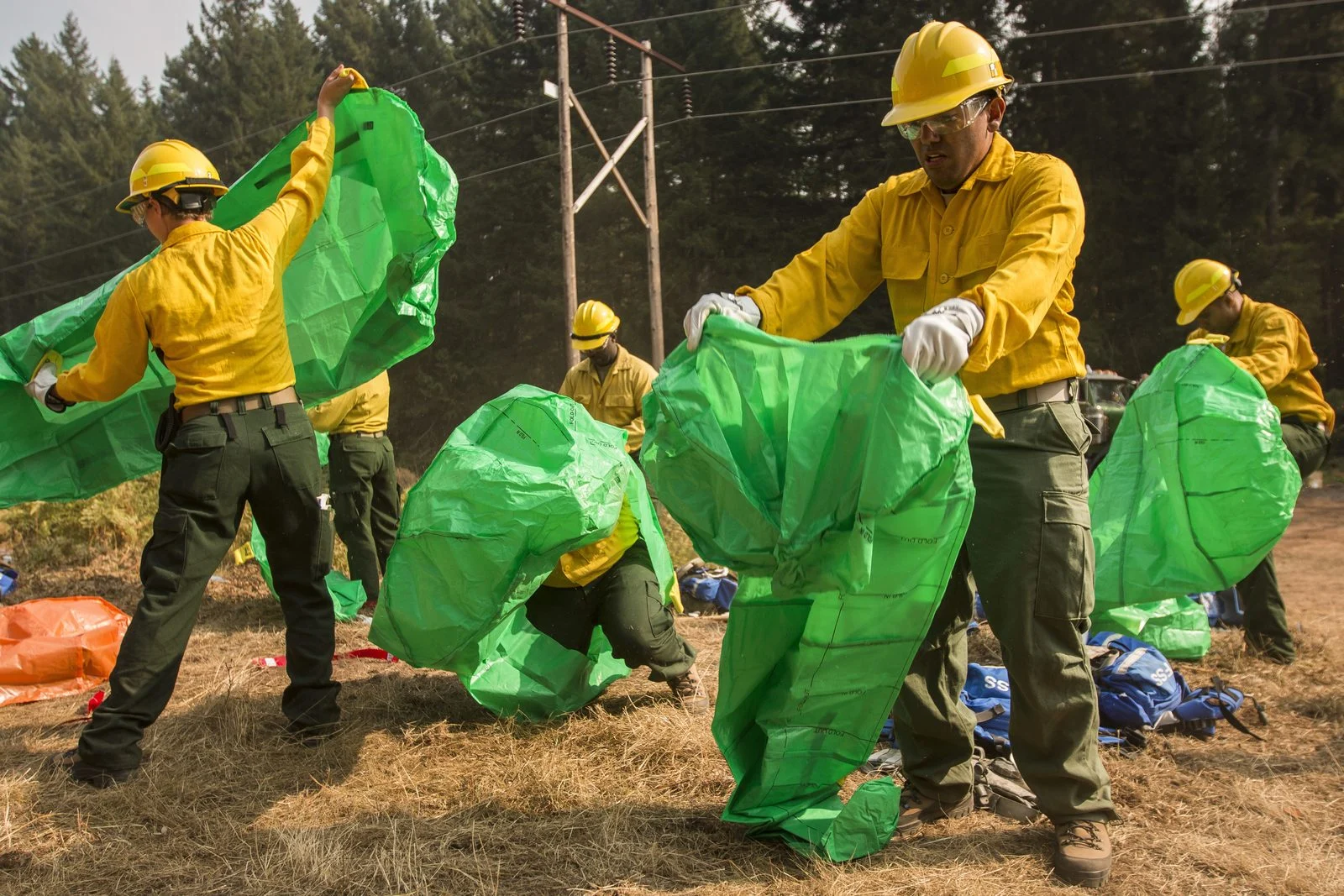 Newfoundland Wildfire Prevention Funding 2026 — Second Round Opens After Summer Blazes 2 Wildland firefighters practising deploying emergency fire shelters during wildfire prevention training