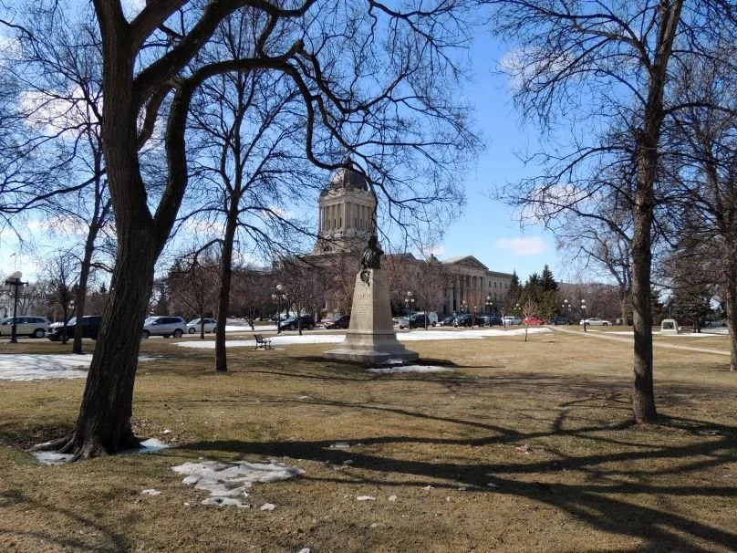 Obby Khan Resigns 2026 — Manitoba Pc Leader Quits Caucus Over Internal Fighting 2 Manitoba Legislature Building grounds during the Obby Khan resignation crisis