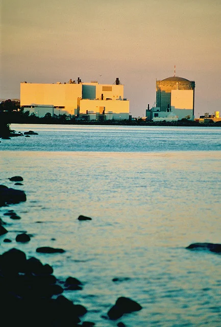 Point Lepreau Shutdown Heavy Water Leak 2026 — 200 Litres Lost, Plant Down Again 2 A Canadian CANDU nuclear station at dusk, similar to the Point Lepreau plant affected by the Point Lepreau Shutdown Heavy Water Leak