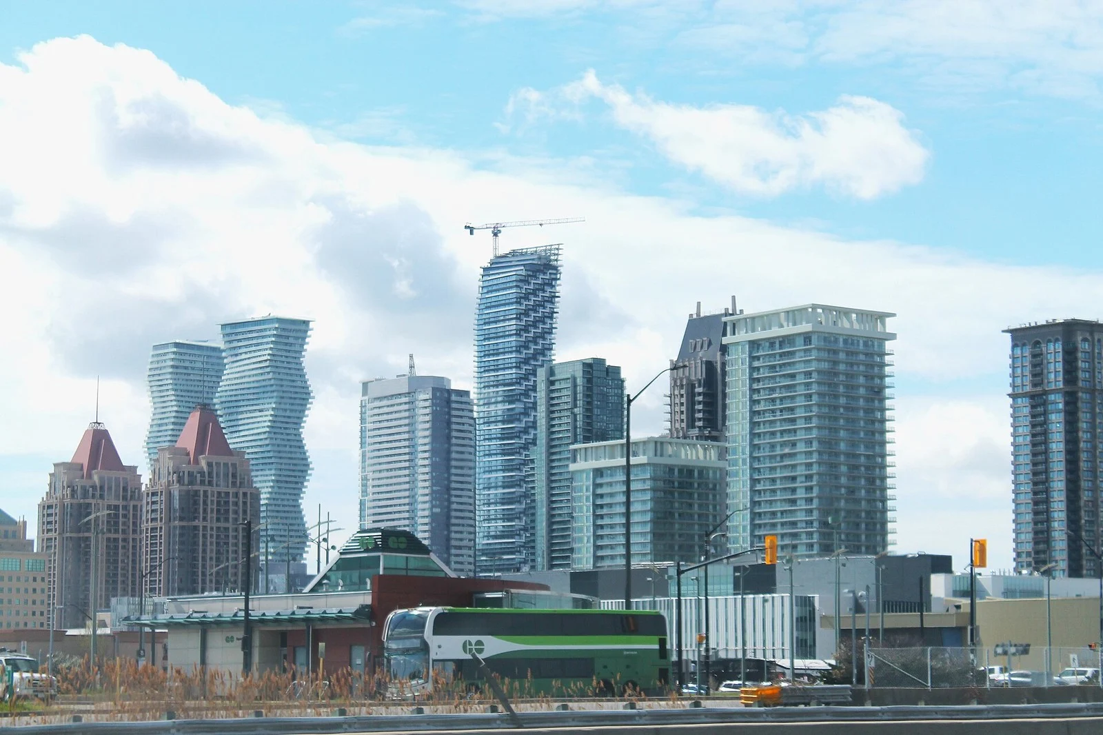 Project Red Zone Ontario 2026 — Peel Police Bust Gta Firearm Trafficking Network Tied To 14 Shootings 2 Project Red Zone Ontario: Mississauga city centre skyline with the Absolute World towers and a GO bus