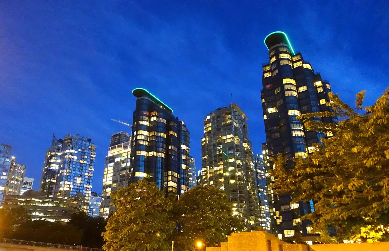 Vancouver International Film Festival 2026 Lineup: Eisenberg Opens, Mcdonagh Closes Vancouver skyline at night, host city of the 45th Vancouver International Film Festival