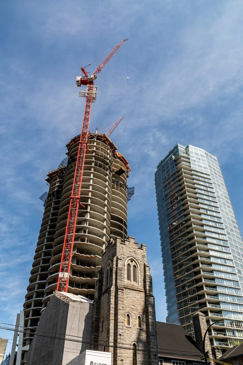 Saskatchewan Construction Week 2026 — 55,900 Workers, 12% Job Growth, And A Province On The Build Saskatchewan Construction Week 2026: red tower cranes over a high-rise building under construction