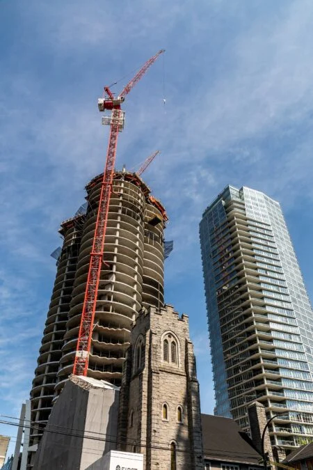 Saskatchewan Construction Week 2026 — 55,900 Workers, 12% Job Growth, And A Province On The Build Saskatchewan Construction Week 2026: red tower cranes over a high-rise building under construction