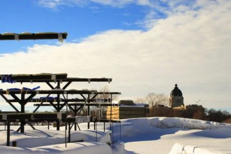 Saskatchewan Protective Services Memorial 2026 — Regina Unveils Permanent Tribute To Fallen Heroes Saskatchewan Legislative Building dome seen over Wascana Park in Regina, near the Saskatchewan Protective Services Memorial site