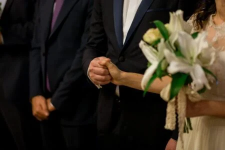 How To Sponsor Your Spouse For Canadian Permanent Residence — The Complete 2026 Guide Bride and groom holding hands