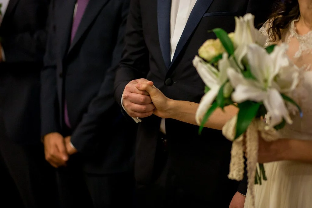 How To Sponsor Your Spouse For Canadian Permanent Residence — The Complete 2026 Guide Bride and groom holding hands