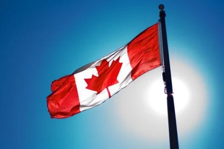 Canada Is Fast-Tracking 33,000 Temporary Workers To Permanent Residence — Are You One Of Them? Canadian flag
