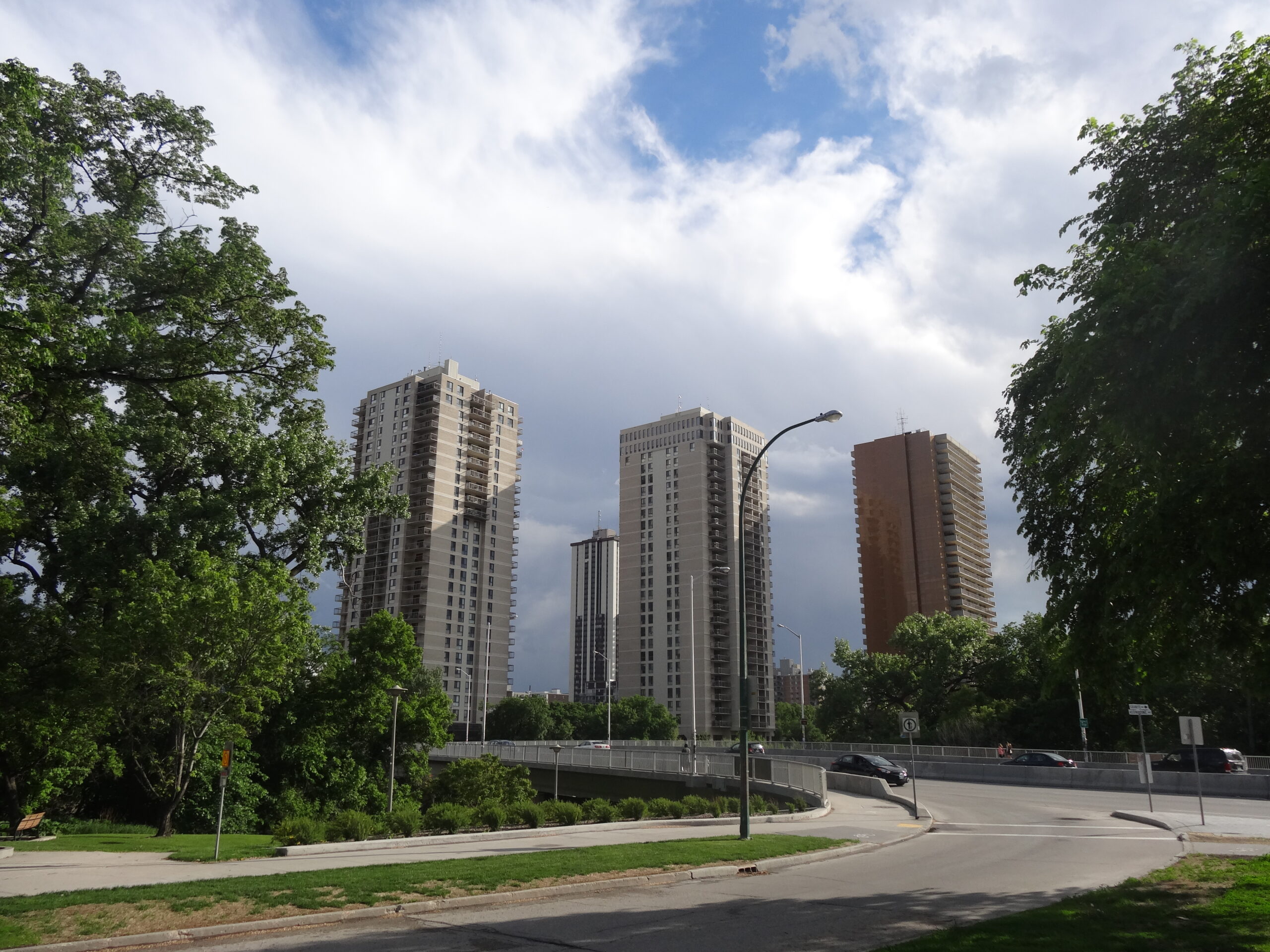 Rent Comparison Winnipeg Vs Toronto 2026 — Where $1,500 A Month Still Rents A Life 3 Residential apartment towers in Osborne Village, Winnipeg