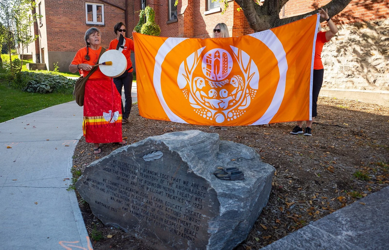 Winnipeg Truth And Reconciliation Treaty One Run 2026 — Orange Shirt Day Comes Early To Winnipeg 2 Winnipeg Truth and Reconciliation Treaty One Run: Truth and Reconciliation commemoration with orange flag and drumming