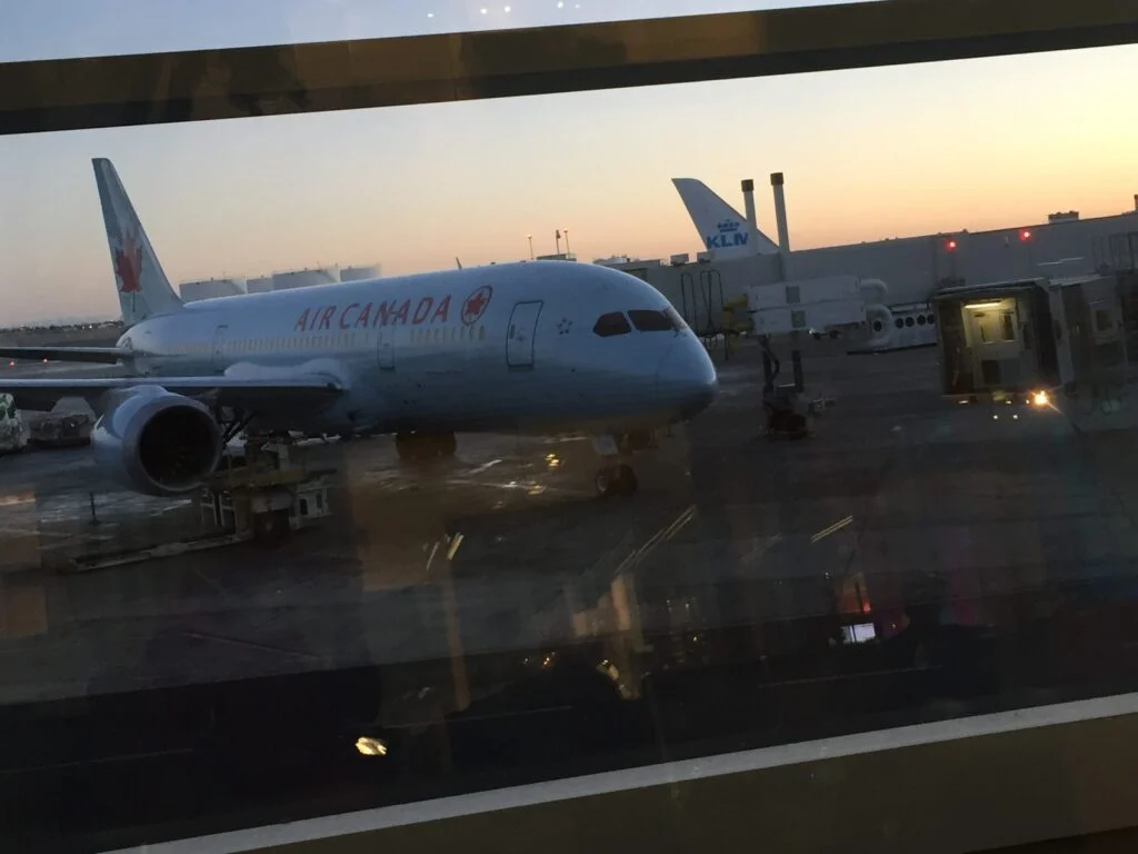 Air Canada Boeing 787-9 at the gate — the Air Canada Montreal Delhi route drops to 4 weekly flights this winter