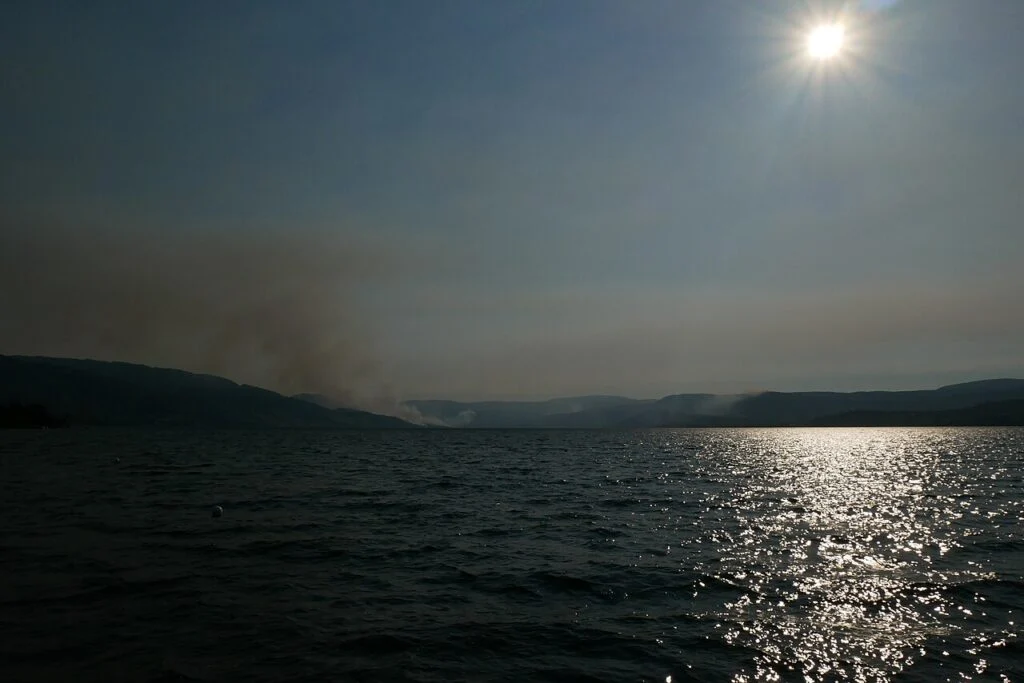 B.c. Election 2026 — Doerkson’S $500M Water-Bomber Fleet Meets Eby’S Grocery Price Guards In The Okanagan Wildfire smoke rising over the Okanagan as the B.C. Election 2026 campaign promises a water-bomber fleet
