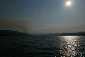 B.c. Election 2026 — Doerkson’S $500M Water-Bomber Fleet Meets Eby’S Grocery Price Guards In The Okanagan Wildfire smoke rising over the Okanagan as the B.C. Election 2026 campaign promises a water-bomber fleet