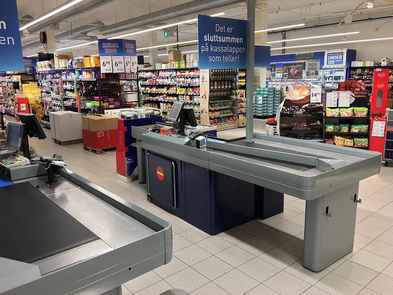 B.c. Election 2026 — Doerkson'S $500M Water-Bomber Fleet Meets Eby'S Grocery Price Guards In The Okanagan 3 Grocery store checkout as Eby's B.C. Election 2026 Price Guard promises to cap margins on staples