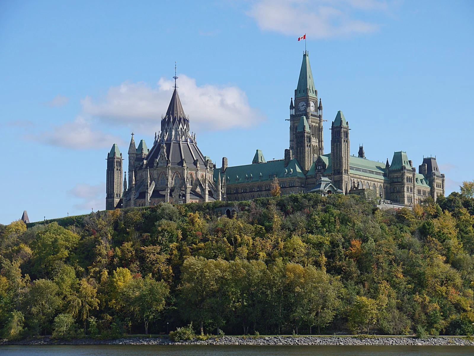 Carney And Ford Meeting 2026: $8.7 Billion Steel, Auto And Ring Of Fire Plan Unveiled In Ottawa 2 Parliament Hill in Ottawa viewed from the Ottawa River; the Carney and Ford Meeting announcement on steel and auto supports happened here today