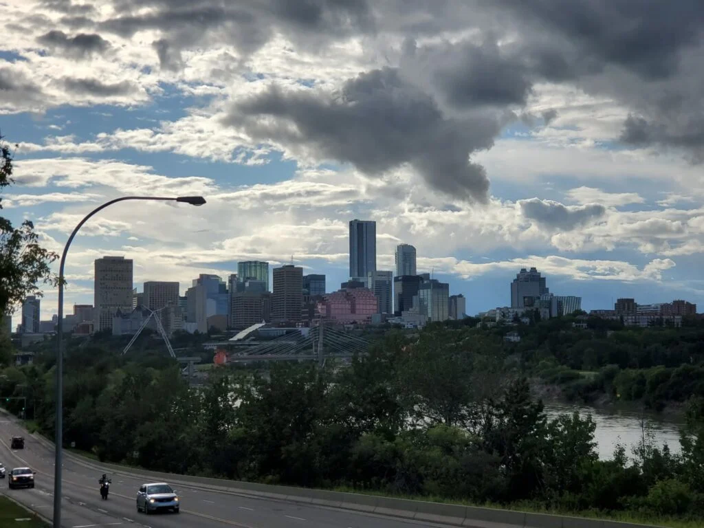 Edmonton skyline under dramatic clouds, the city losing BioWare in the BioWare Edmonton Closure