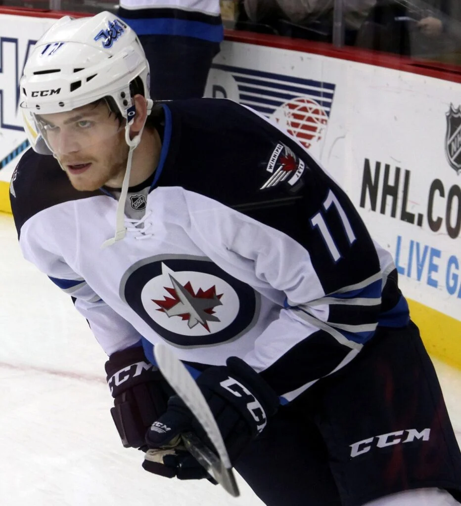 Winnipeg Jets player Adam Lowry on the ice in a Jets jersey, featured image for the Jets girls hockey legacy story