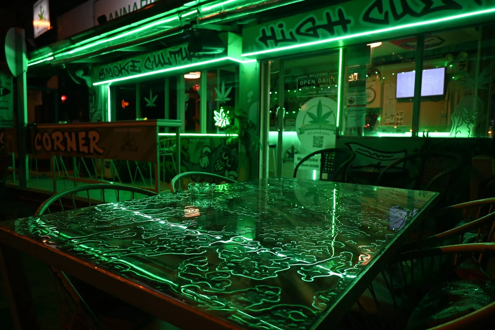 Manitoba Bill 56 2026 — Cannabis Stores Could Drop Window Coverings To Protect Workers 3 A cannabis dispensary glowing at night — Manitoba Bill 56 aims to stop cannabis workers from being secluded from public view