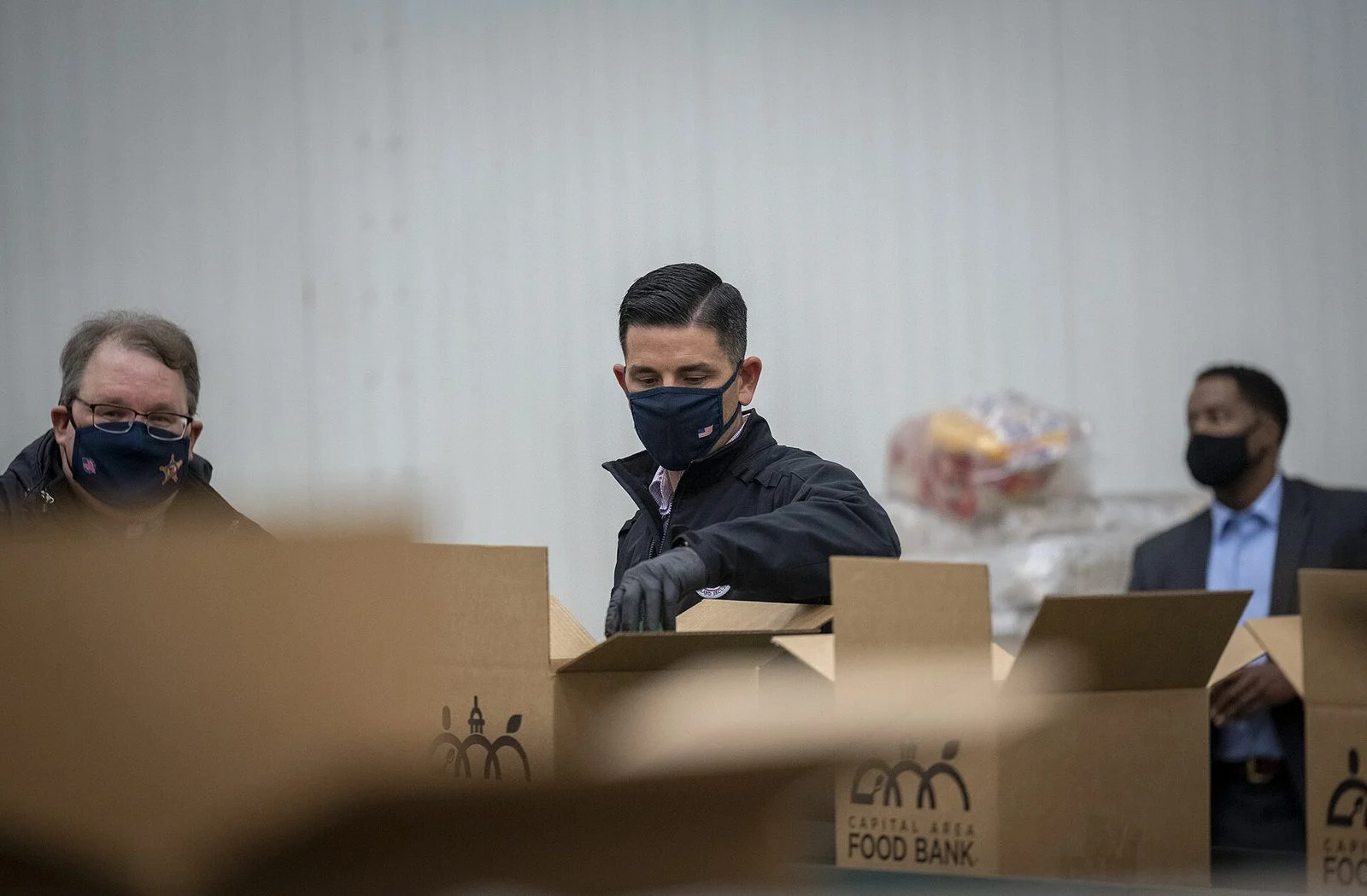 Montreal Hungercount 2026: Food Bank Demand Hits A Record 1.25 Million Monthly Requests 1 Volunteers packing food boxes at a food bank as Montreal HungerCount 2026 demand hits a record