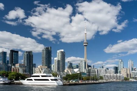 Ontario Minimum Wage 2026 — $17.95 And Still Not Enough The Toronto skyline, representing Ontario where Ontario Minimum Wage 2026 now stands at $17.95 per hour
