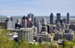 Quebec’S New Premier Unveils $28M In Emergency Homelessness Funding As Winter Nears Montreal skyline, illustrating the city receiving nearly $18M in Emergency Homelessness Funding