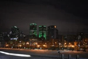 Quebec 2026 — Peq Applications Forecast Shattered As 12,364 Applications Flood In Two Months PEQ Applications Forecast: Montreal skyline at night