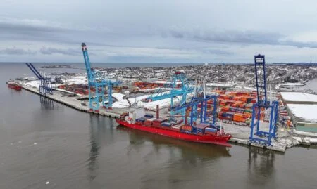 Saint John Trade Corridor 2026: Ottawa Puts $254M Into N.b. Port And Rail Upgrades Port of Saint John container terminal in New Brunswick with cranes and a container ship