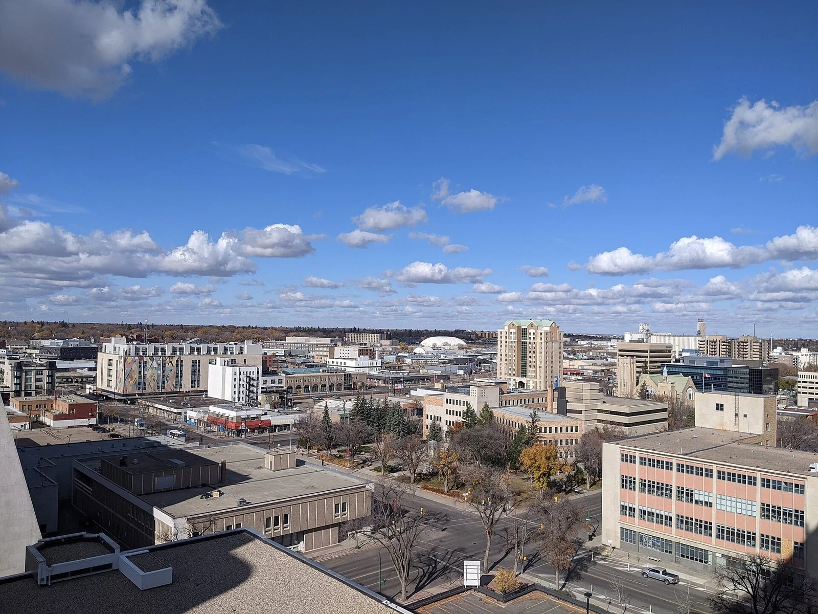 Saskatchewan Minimum Wage 2026 — $15.70 Is In, And It'S Still $3 Short Of A Living Wage 2 Downtown Saskatoon skyline — Saskatchewan Minimum Wage still trails the living wage