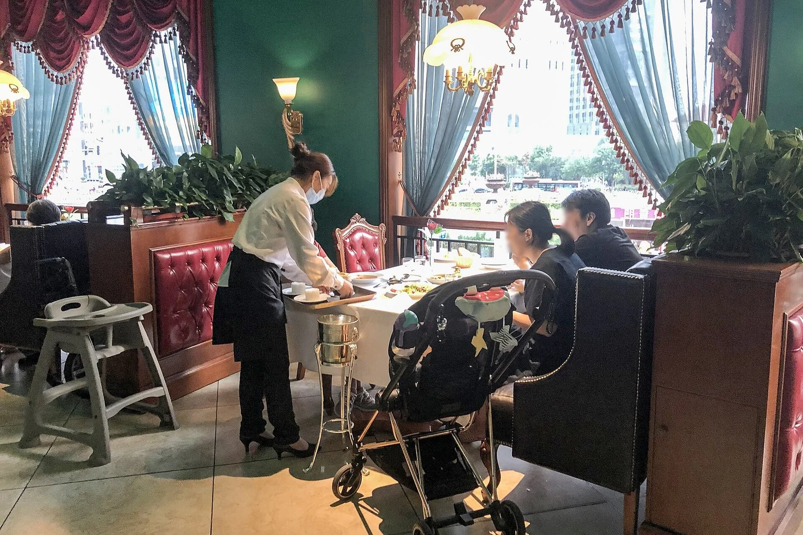 Saskatchewan Minimum Wage 2026 — $15.70 Is In, And It'S Still $3 Short Of A Living Wage 3 Restaurant server at work — Saskatchewan Minimum Wage covers many food-service workers (file photo)