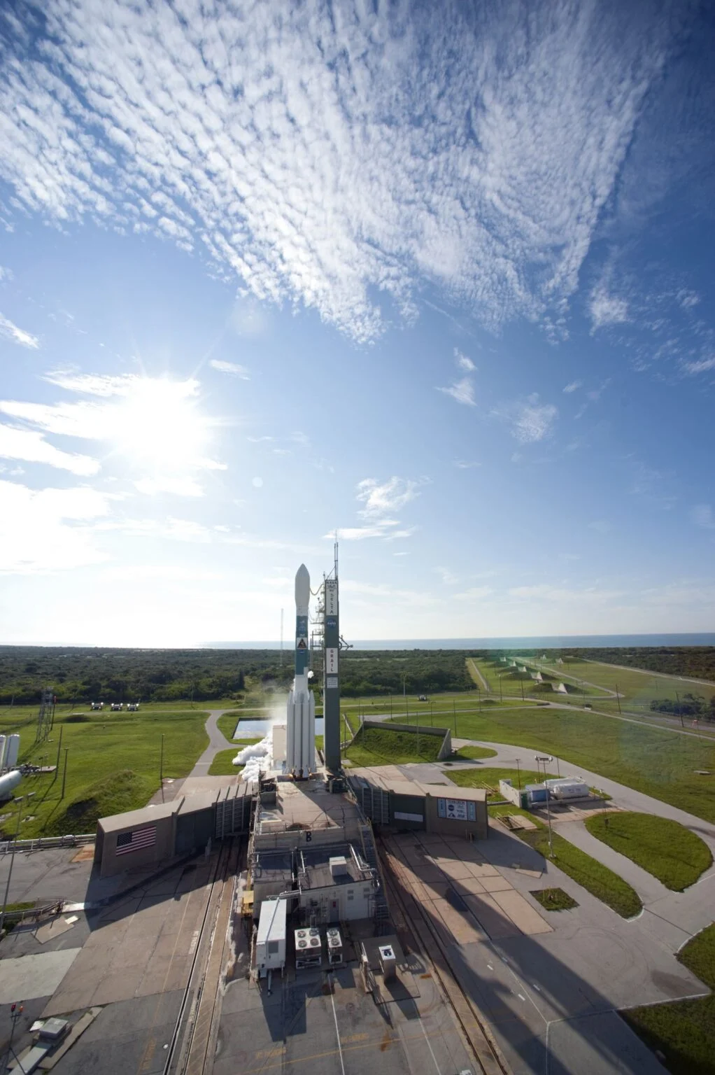 Spaceport Nova Scotia 2026 — Launch Pad Handover To Isar Aerospace On Track For November 1 Spaceport Nova Scotia: a rocket on its launch pad at liftoff (generic launch imagery — Isar's Spectrum pad at Canso is under construction)