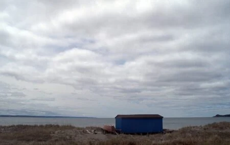 Stephenville Crossing Demolition 2026 — N.l. Axes Contaminated Building, Redevelopment Abandoned A beach shack on the shoreline at Stephenville Crossing, Newfoundland and Labrador