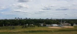 Mike Vogiatzakis 2026 — Mayoral Candidate Says Living Outside Winnipeg “Doesn’T Matter” Downtown Winnipeg skyline — mayoral candidate Mike Vogiatzakis says living outside the city doesn't matter