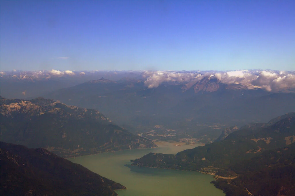 Woodfibre Lng Economic Study 2026 — $11.6 Billion In Government Revenue, Says Deetken Aerial view of Howe Sound and Squamish, British Columbia, home of the Woodfibre LNG Economic Study project site
