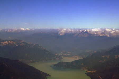 Woodfibre Lng Economic Study 2026 — $11.6 Billion In Government Revenue, Says Deetken Aerial view of Howe Sound and Squamish, British Columbia, home of the Woodfibre LNG Economic Study project site