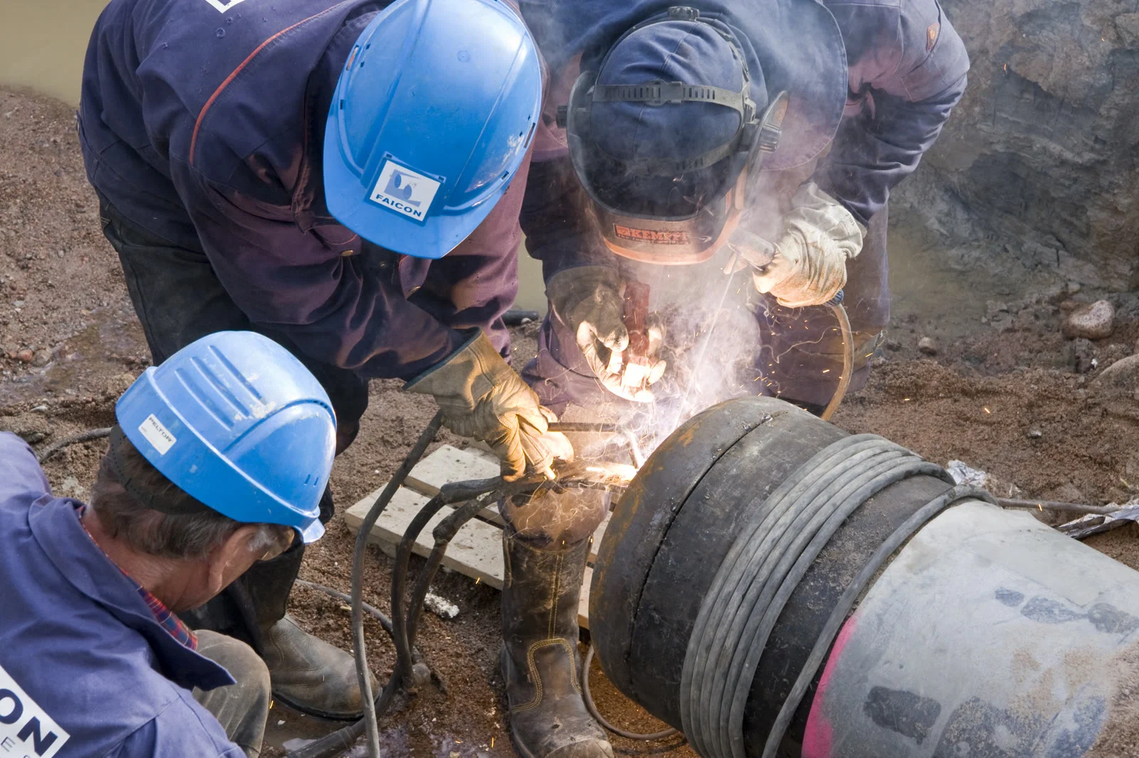 Woodfibre Lng Economic Study 2026 — $11.6 Billion In Government Revenue, Says Deetken 3 Workers constructing a natural gas pipeline, like FortisBC's Eagle Mountain Pipeline covered in the Woodfibre LNG Economic Study